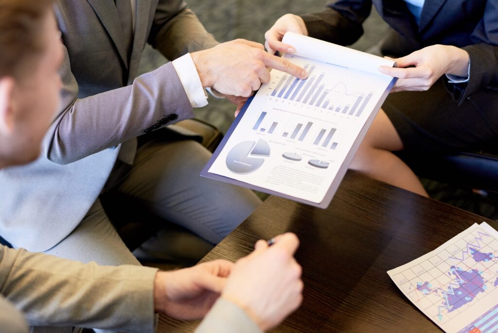 Businesspeople reviewing charts and graphs