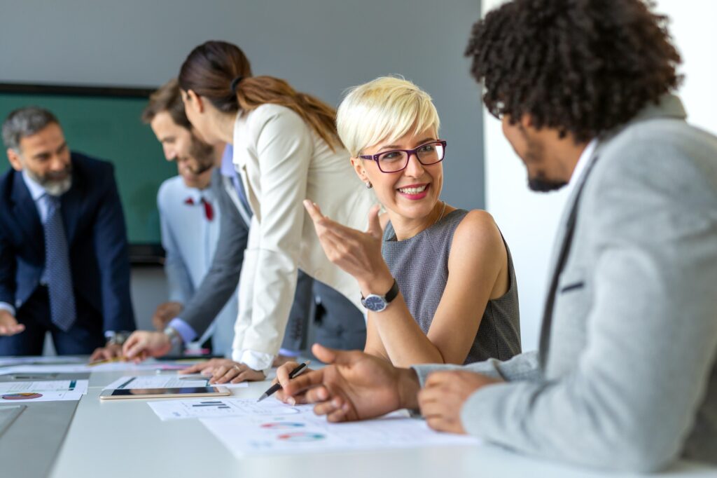Diverse team discussing project at conference table